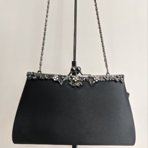 Jessica McClintock clutch with metal strap